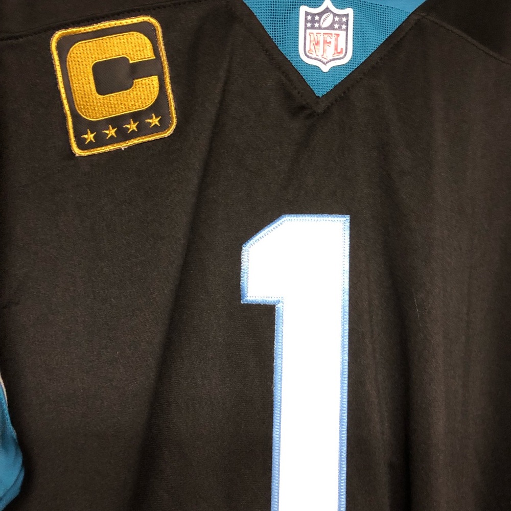 Cam Newton jersey with “Captains” patch